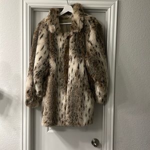 Reversible knee length fur coat.